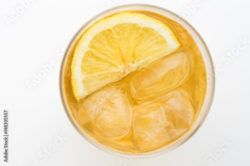 Glass of lemon ice tea isolated on white background. From top view