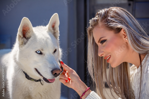 Beautiful elegant woman with a beautiful husky dog