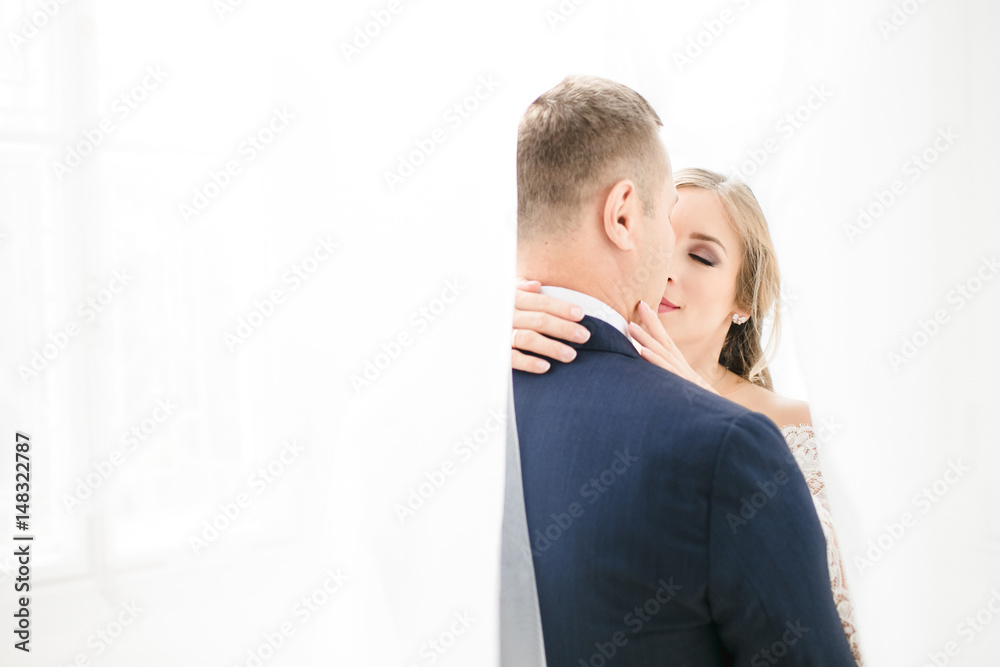 The lovely couple in love embarcing in the room The lovely couple in love embarcing in the room