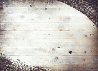Fishing nets on wooden background. Still-life and objects.