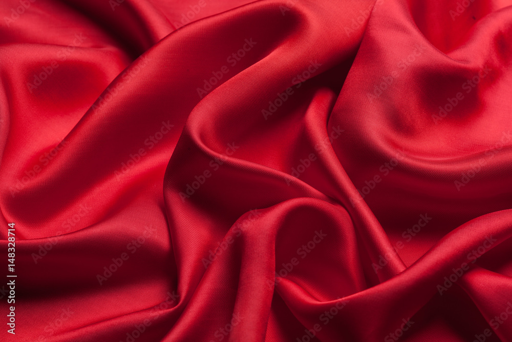 Obraz premium Red cloth waves background texture