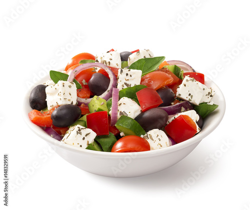 Greek salad in a bowl, on white background
