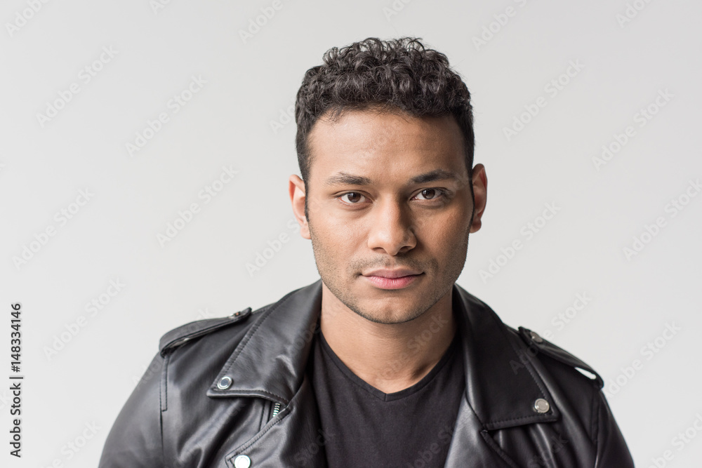 Obraz premium portrait of serious young african american man isolated on grey