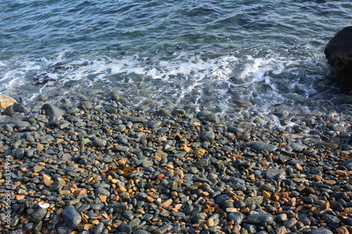 Fototapeta Naklejka Na Ścianę i Meble -  sea foam wave on the rocks