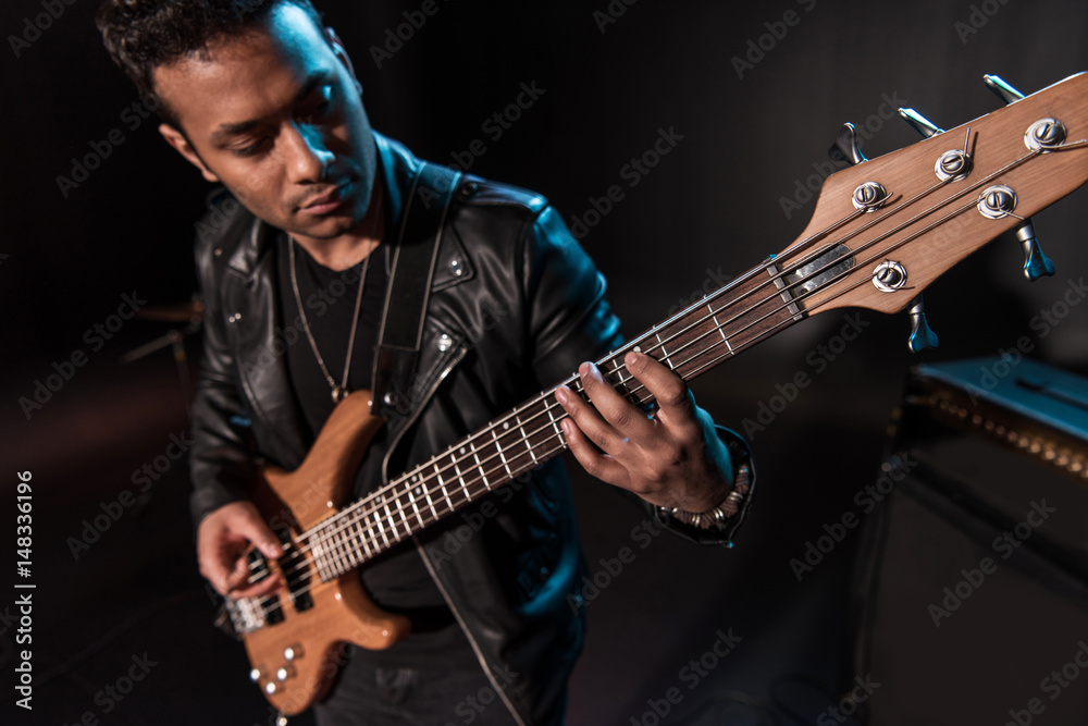 © LIGHTFIELD STUDIOS - Electric guitar player performing hard rock music with bass guitar on stage © LIGHTFIELD STUDIOS - Electric guitar player performing hard rock music with bass guitar on stage