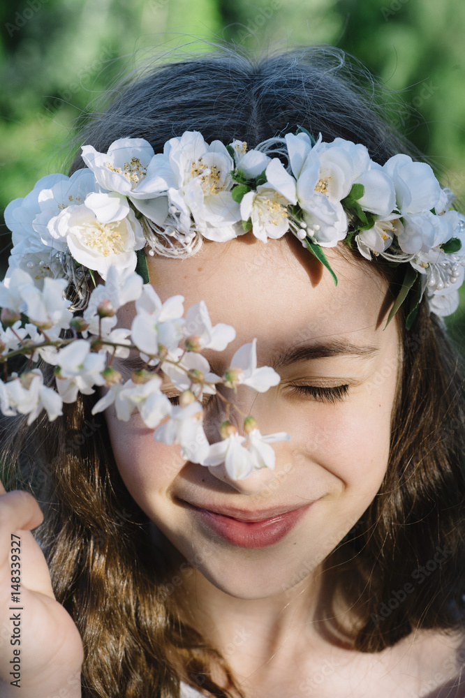 Obraz premium Attractive blond girl in forest dressed in communion