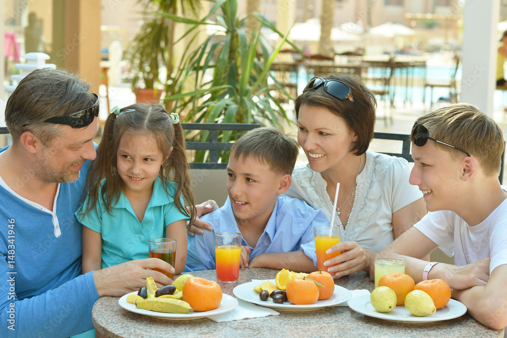 Happy parents with their children eating Happy parents with their children eating