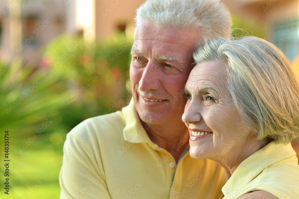 Happy elderly couple embracing