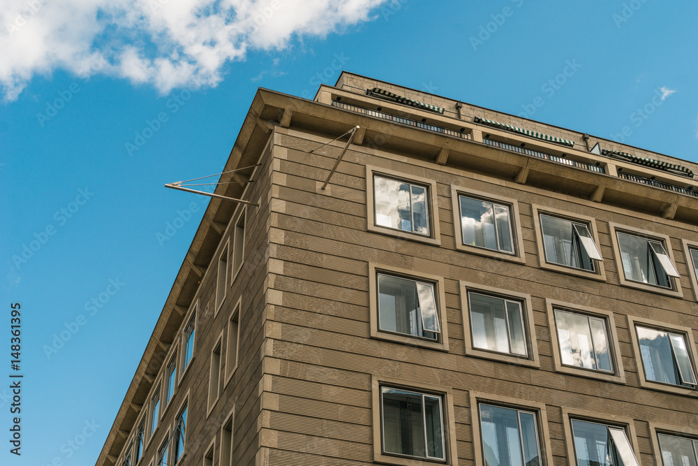 brown office building with big windows