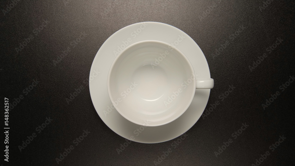 TOP VIEW: White coffee cup on black table TOP VIEW: White coffee cup on black table