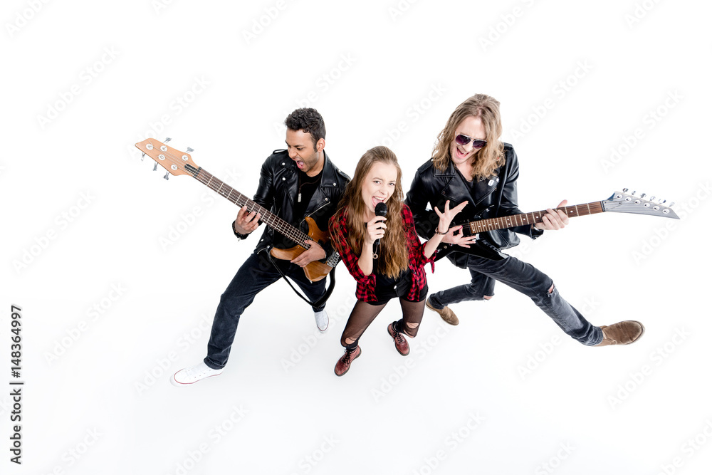 Fototapeta premium singer with microphone and musicians with electric guitars isolated on white, rock and roll band concept