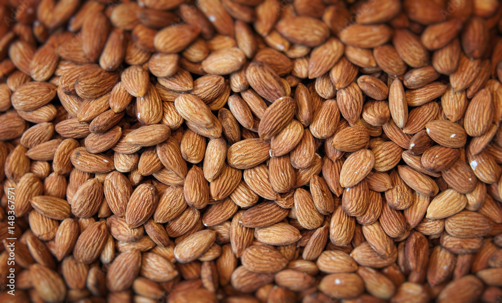 Pile of almonds close-up as background. oriental market Pile of almonds close-up as background. oriental market
