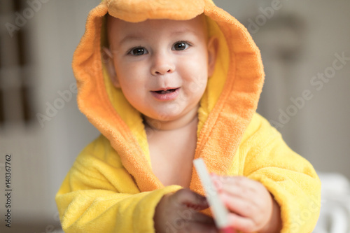 baby boy in yellow robe