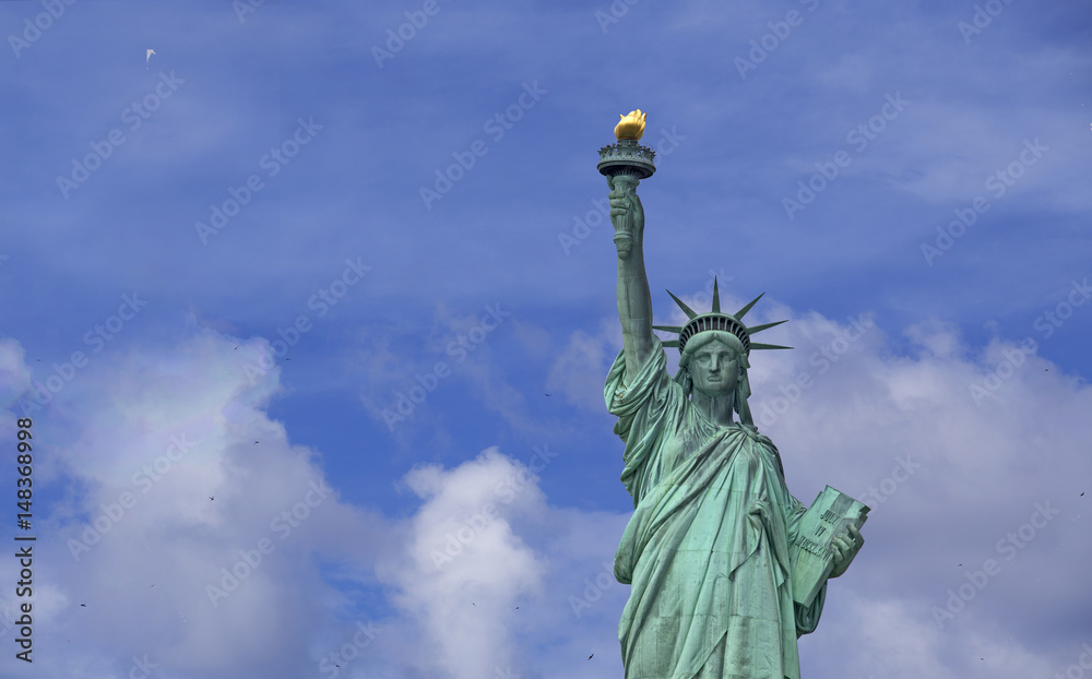 Fototapeta premium Statue of Liberty over blue sky