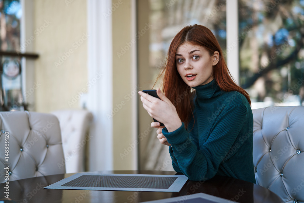 surprised woman with mobile phone, cafe, free internet