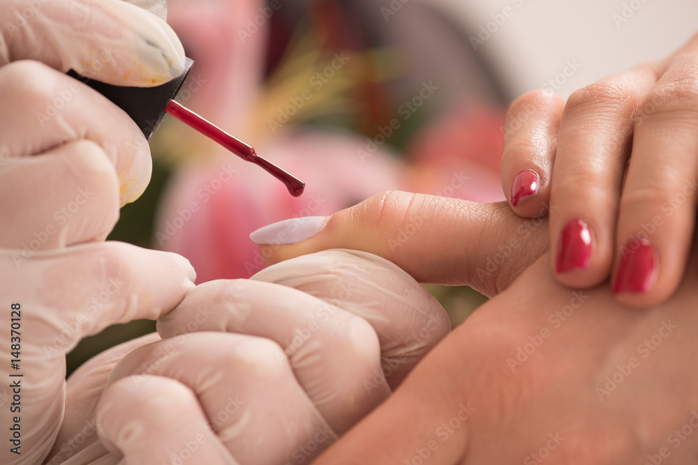 Woman hands receiving a manicure Woman hands receiving a manicure