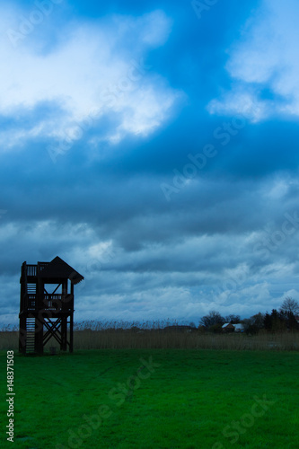 sunset landescape with obserwation tower and sky photo