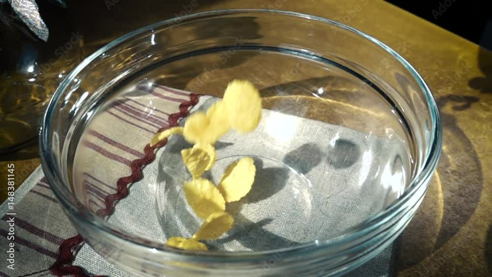 Crispy yellow corn flakes into the bowl for the morning a delicious Breakfast with milk. Slow motion with rotation Crispy yellow corn flakes into the bowl for the morning a delicious Breakfast with milk. Slow motion with rotation