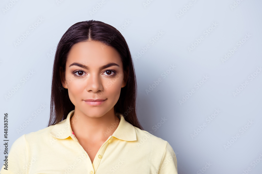 Confident young hispanc woman in casual clothes on pure light blue backgrund Confident young hispanc woman in casual clothes on pure light blue backgrund