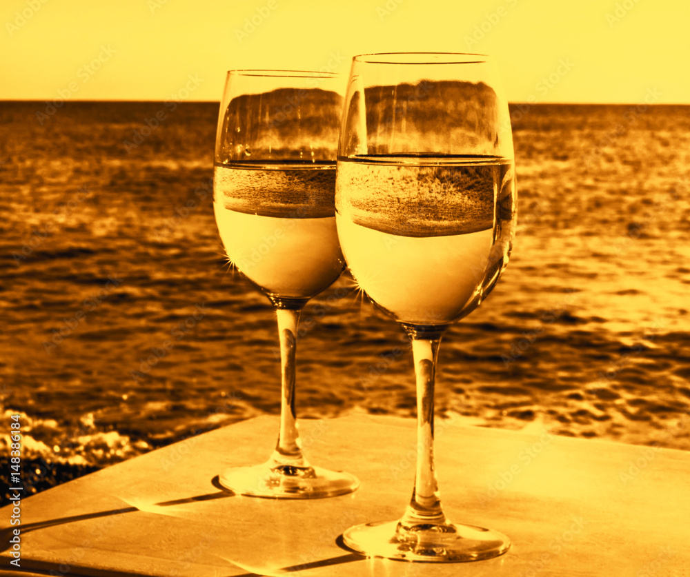 Two glasses of wine on beach
