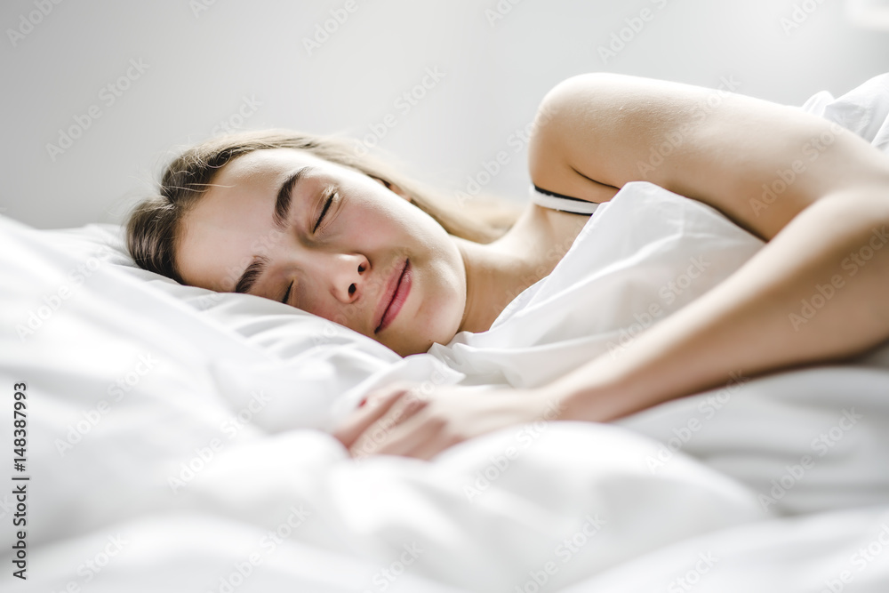 beautiful young woman with long hair sleeping on bed in bedroom beautiful young woman with long hair sleeping on bed in bedroom
