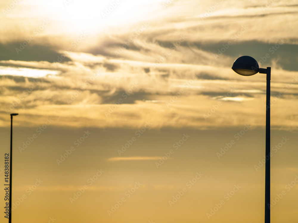 Street lights on sunset on and urban landscape Street lights on sunset on and urban landscape