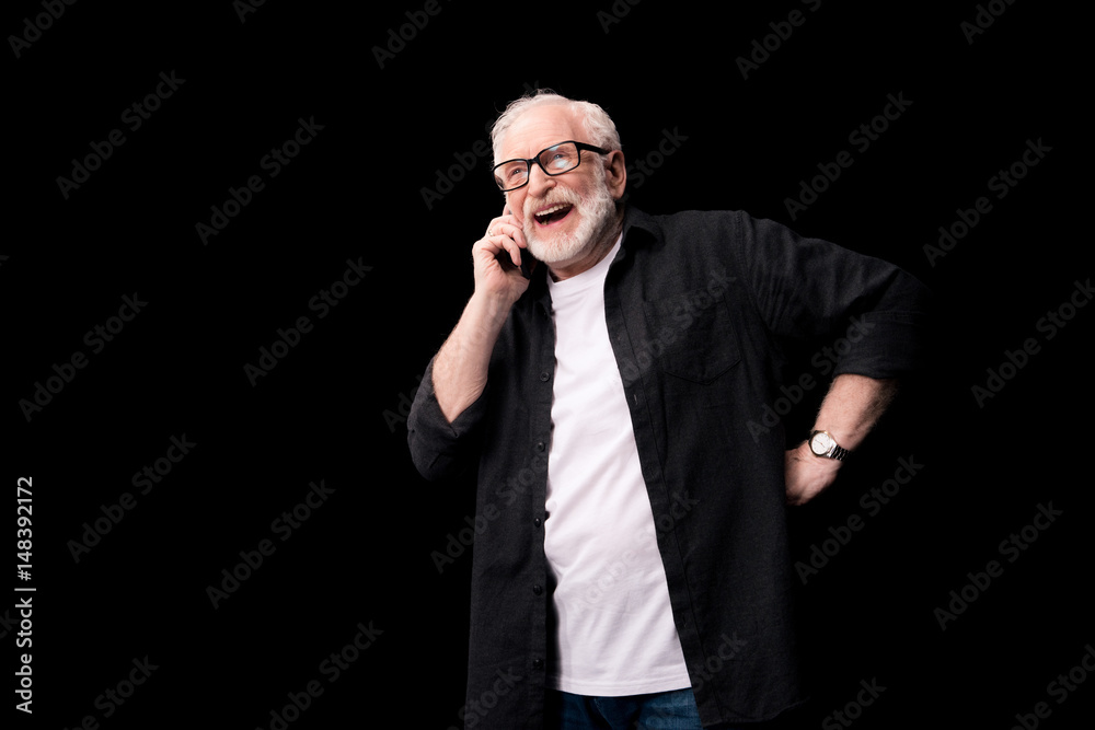 senior man talking on smartphone senior man talking on smartphone