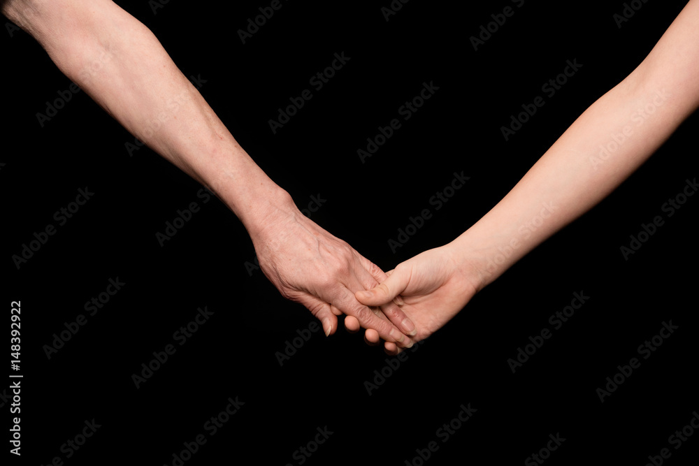 Grandmother and granddaughter holding hands