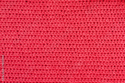 Closeup of red crochet fabric