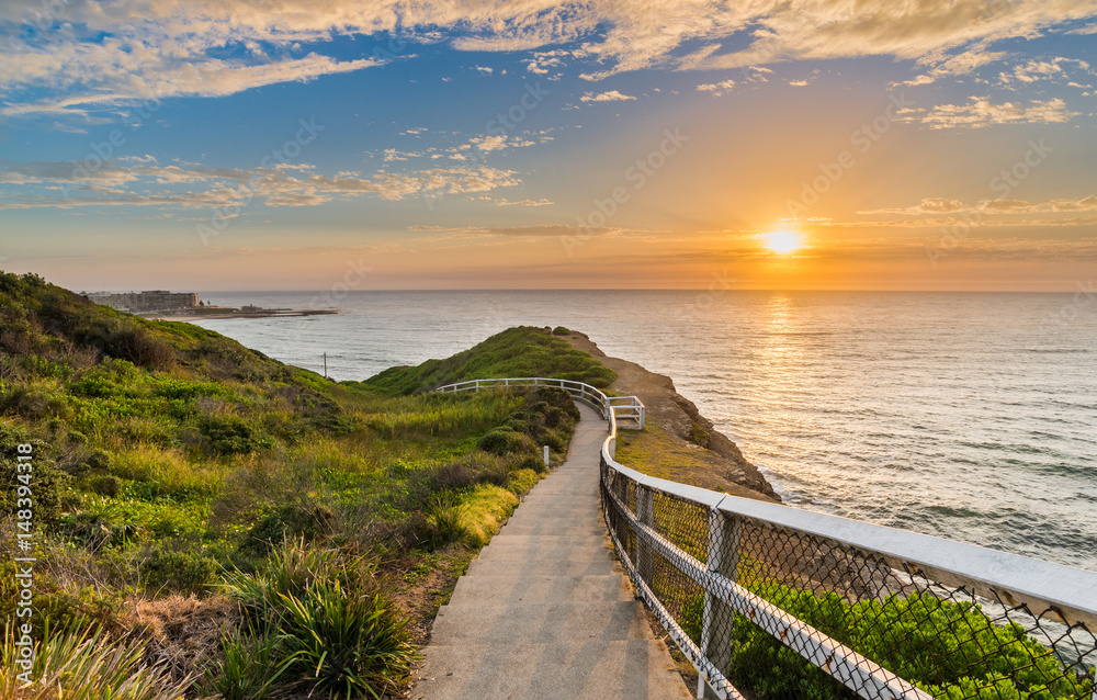 Seaside path at sunrise in Newcastle, Australia - obrazy, fototapety, plakaty 