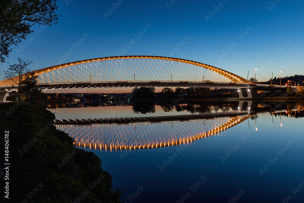 Naklejka premium Troja bridge Prague over the Vltava river in the night with illumination. Trojsky most . Czech Republic