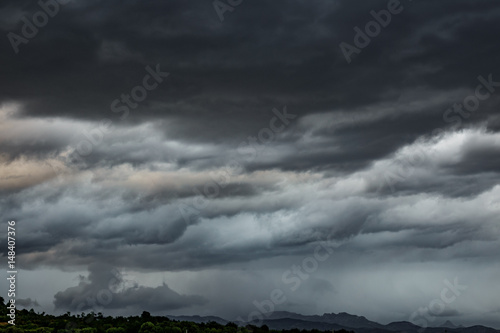 Cloudy sky, dark clouds, close storm over mountain range