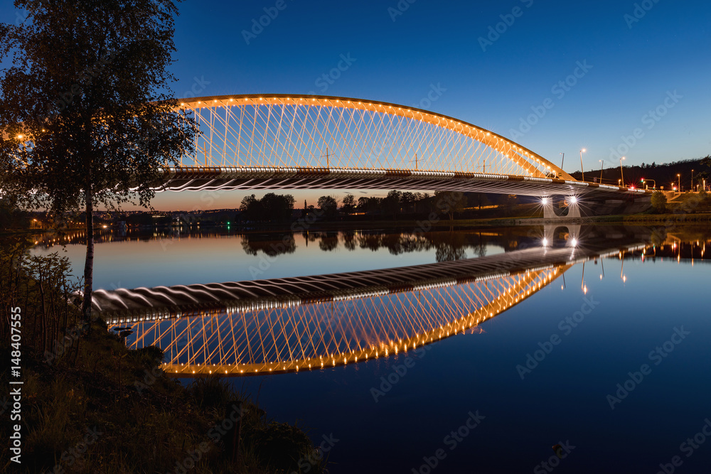 Naklejka premium Troja bridge Prague over the Vltava river in the night with illumination. Trojsky most . Czech Republic