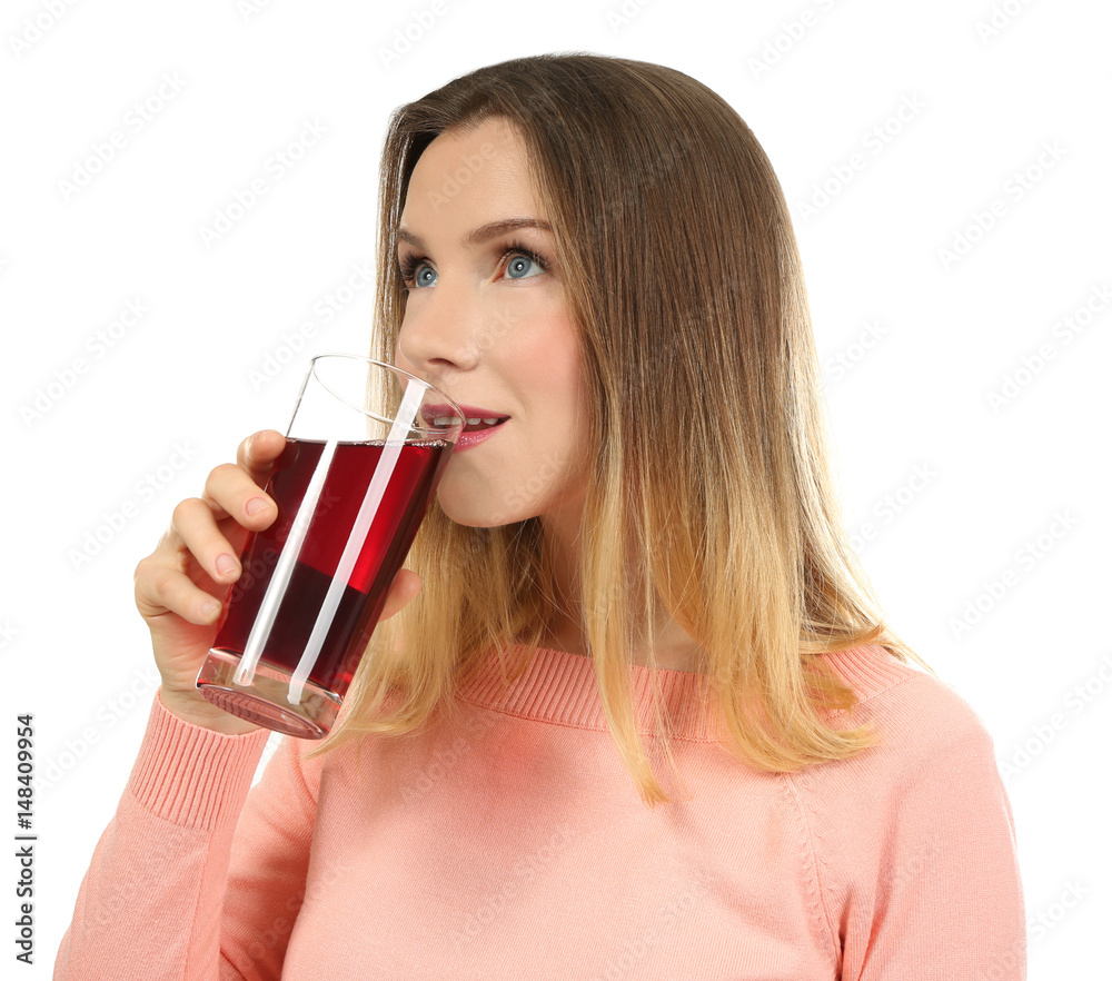 Beautiful woman drinking fresh juice on white background