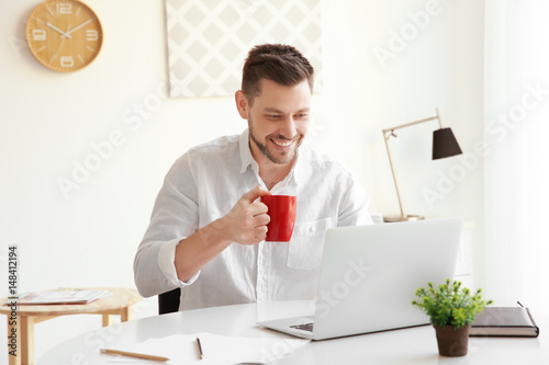 Handsome young man working ...