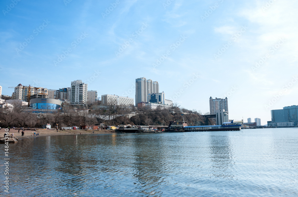 Russia, Vladivostok, April 7: sea bay, city buildings