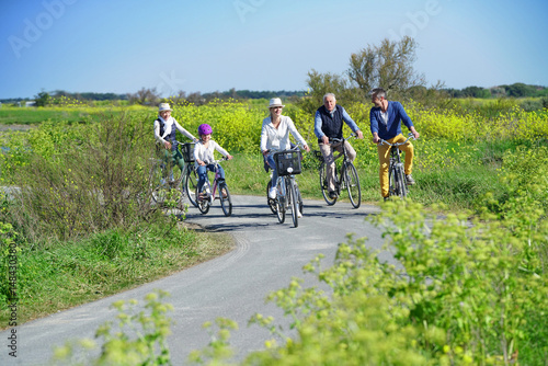 Happy family riding bikes on a beautiful journey