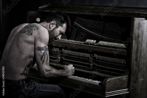 angry man at the piano