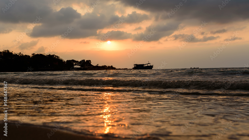 Sunrise  and shadow boat on sea near the beach ,Koh Samet Thailand