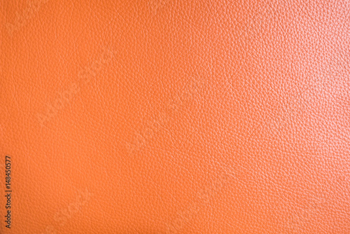 texture of orange genuine leather for background or graphic resources © angyim