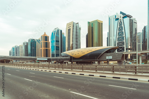 Photography View of Dubai Metro and skyline.