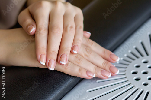Female hands with the french manicure