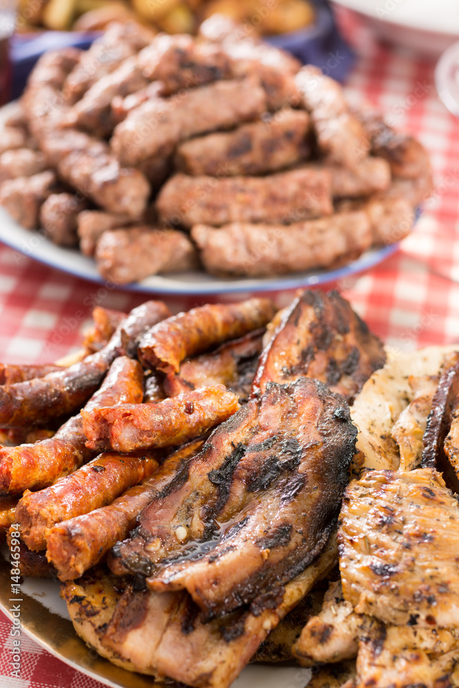 Barbecue meat and sausages served on the table