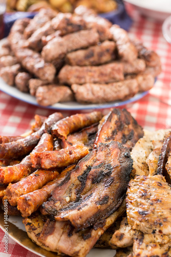 Barbecue meat and sausages served on the table