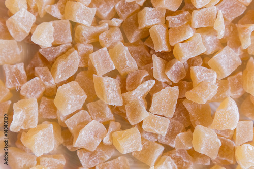 Sweet candied ginger cubes background
