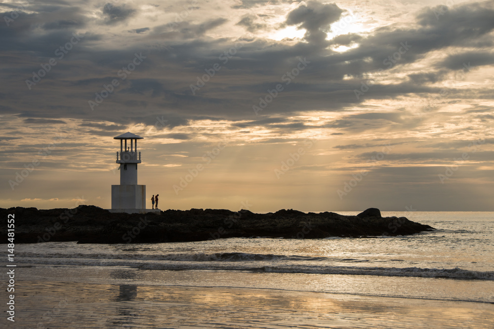 Small light house at Kao-lak beach in south region of Thailand with evening sunlight beam.