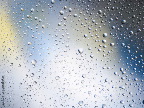Water drops color background rain glass space rainbow.