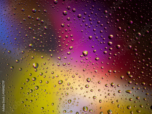 Water drops color background rain glass space rainbow.