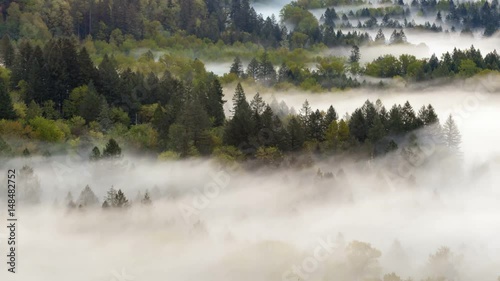 Ultra high definition 4k uhd time lapse closeup video of low moving and rolling fog and mist over Sandy river from Jonsrud viewpoint in Sandy OR 4096x2304 photo