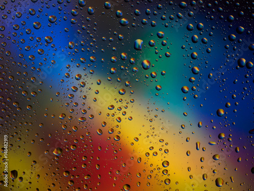 Water drops color background rain glass space rainbow.